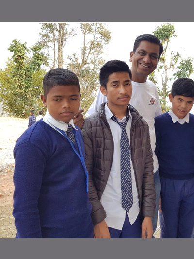 Dr Agrawal with visually impaired children in a blind school in Gorkha, Nepal